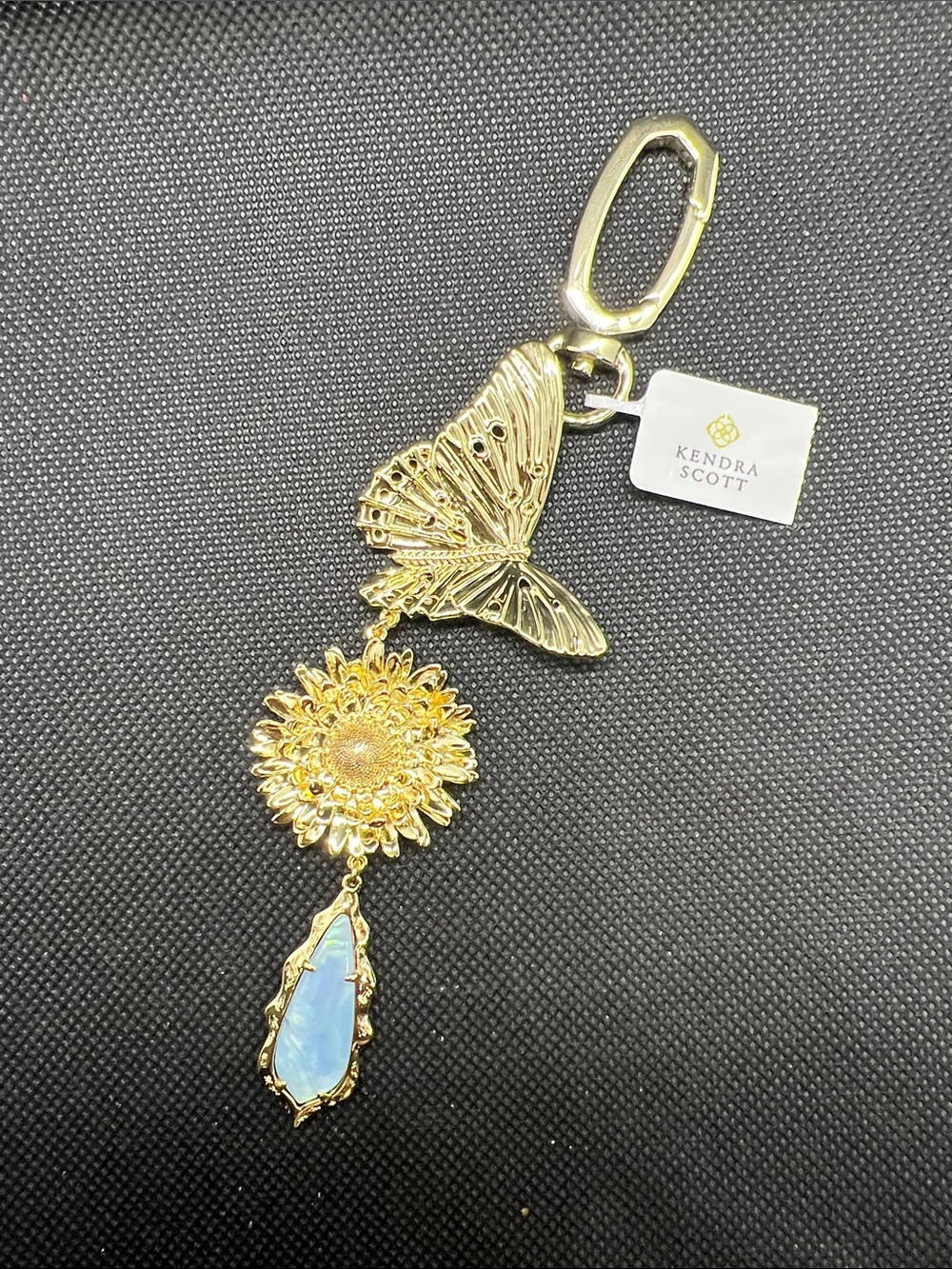 Kendra Scott Gold Butterfly Sunflower Keychain with Blue Opalescent Stone